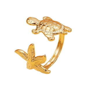 Gold adjustable stainless steel ring featuring sea turtle and starfish oceanic charms
