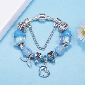 Blue dolphin charm bracelet with glass beads and heart pendant on silver snake chain