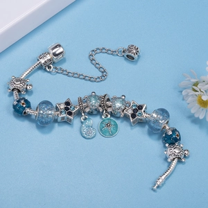 Ocean-themed charm bracelet with blue glass beads, starfish, and sea turtle charms
