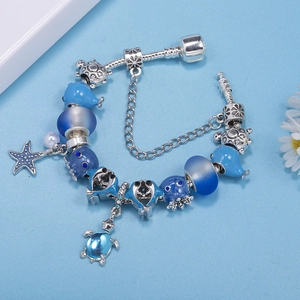 Marine themed silver snake chain bracelet with blue dolphin and turtle charms