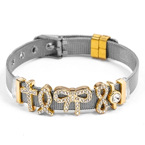 Adjustable silver mesh bracelet with gold charms and sparkling crystal details
