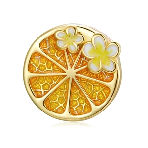 Golden orange slice charm with white enamel flowers and intricate citrus pulp texture