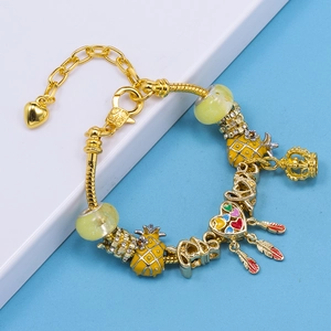Golden snake chain bracelet with colorful enamel pineapple beads and feather charms