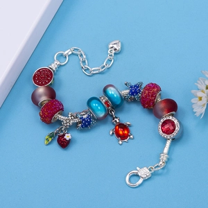 Colorful crystal beaded bracelet with strawberry and turtle pendants on snake chain