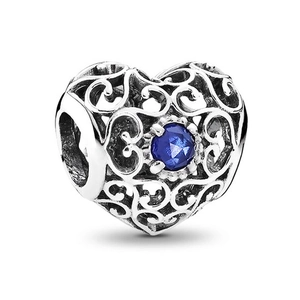 Hollow heart charm bead in polished silver with a faceted blue crystal stone inlay
