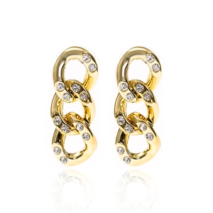 Golden CCB chain link earrings with rhinestones on white background with reflection