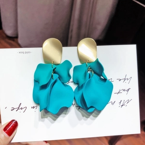 Detail of 925 silver needle gold metal plate and teal blue frosted petal earrings