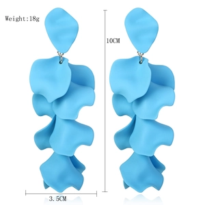Detail showing matte light blue tiered petal tassel earrings with 10cm length dimensions