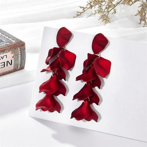 Elegant long red matte petal tassel earrings hanging on a white display card in a set