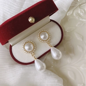 Baroque teardrop pearl earrings with sun flower design in vintage gold finish