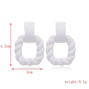 Macro detail of white matte geometric square earrings with dimensions 4.5cm by 3cm
