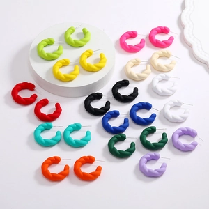 Colorful matte twisted C-shaped hoop earrings set in twelve vibrant dopamine colors