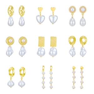 Set of 9 vintage baroque irregular pearl earrings with textured gold-tone metal charms