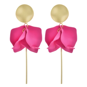 Macro detail of elegant petal earrings with matte pink texture and long golden rods