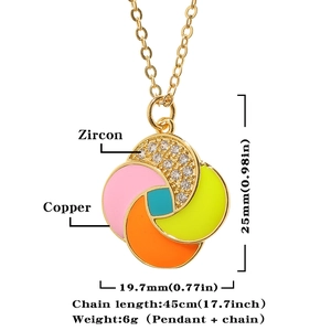 Detailed view of colorful enamel windmill pendant with sparkling zircon inlays and golden chain