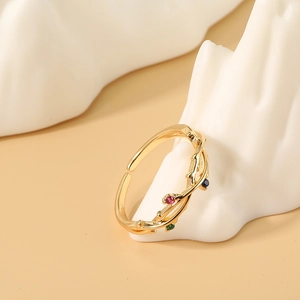 Anillo abierto dorado con forma de rama y circonitas de colores para mujeres