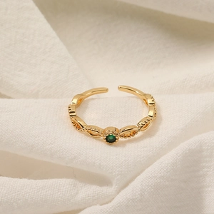 Anillo ajustable chapado en oro con circonita verde y textura tejida para mujer chic