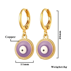 Detail view of gold enamel evil eye earrings showing 26mm height and 11mm width