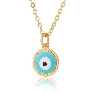 Close-up of golden evil eye pendant with blue enamel detail and polished beaded border