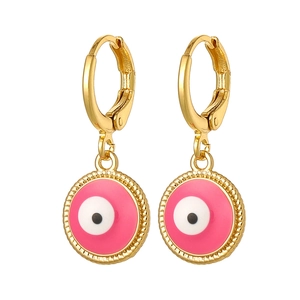 Detailed view of gold evil eye drop earrings with pink and white enamel charms