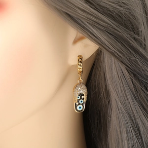 Goud vergulde hiphop oorbellen met zirkonia en evil eye bedeltjes voor dames
