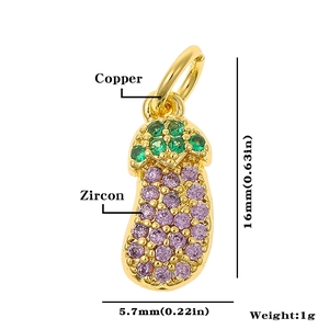 Detailed view of an eggplant pendant with green and purple zircon in copper