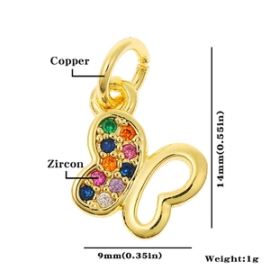 Detailed close-up of a 14mm gold copper butterfly pendant with colorful zircon stones