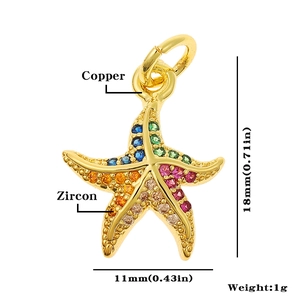 Macro detail of a 18mm colorful zircon starfish pendant made of high-quality gold copper