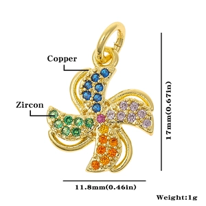 Detail view of a gold windmill charm with colorful zircon stones and size dimensions