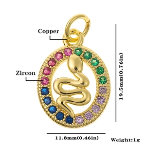 Detailed macro view of gold-plated snake charm with colorful zircon stones and dimensions