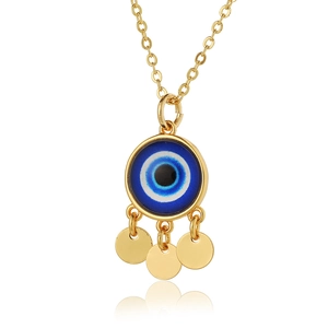 Detailed view of golden evil eye necklace with three hanging discs and blue center