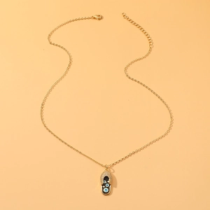 Collana dorata con ciondolo a infradito con strass e malocchio per donna elegante