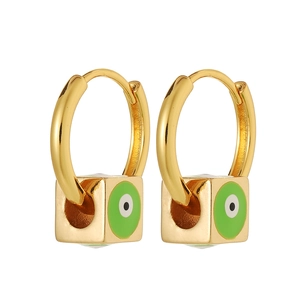 Detail of 18K gold-plated hoop earrings featuring green enamel cube evil eye pendants