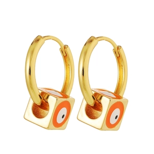 Detail of square Evil Eye charms on gold hoops featuring orange and white enamel accents