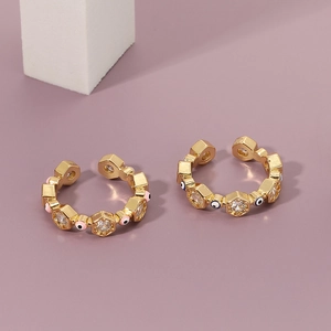 Detailed view of adjustable evil eye rings with blue and pink zircon in gold plating