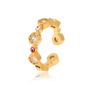 Detail of gold evil eye ring featuring hexagon zircons and colorful enamel beads