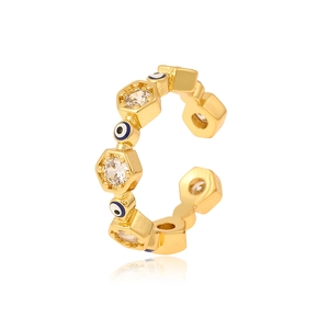 Macro view of gold evil eye open ring with hexagonal zircon stones and blue inlay