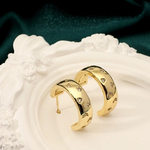 Pendientes vintage de cobre con circonitas y motivos de luna y estrellas