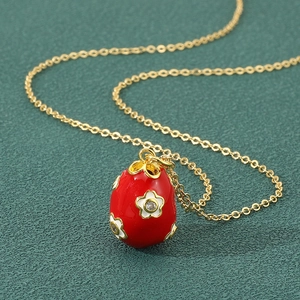 Faberge style red enamel egg pendant necklace with white flowers and zircon crystals