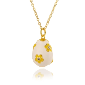 Close-up of white enamel egg pendant with yellow flower inlay on a gold chain