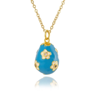Gold flower necklace with blue enamel egg pendant and zircon stones on white backdrop