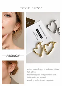 Detail of 925 silver needle heart hoop earrings with gold plating for dual-wear styles