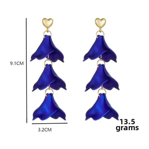 Detail view of long petal drop earrings with size measurements of 9.1cm length and 3.2cm width