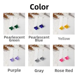 Showcase of floral pearl chain earrings in green, blue, yellow, purple, grey and rose