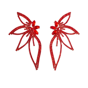 Detailed view of large red leaf earrings encrusted with sparkling rhinestones for women