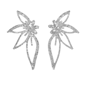 Macro shot of silver oversized flame earrings featuring intricate rhinestone crystal details
