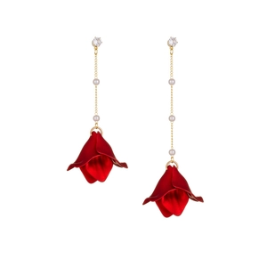 Red petal tassel earrings with gold pearl chains and rhinestone studs on white background