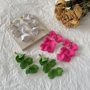 Long layered petal earrings in white rose and green colors with golden heart studs