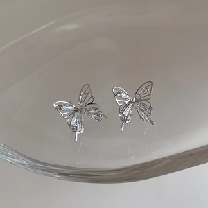 Silver butterfly stud earrings with sparkling zircon stones in a hollow wing design