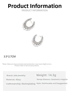 Detailed view of silver-tone U-shaped earrings with colorful crystals and pearls
